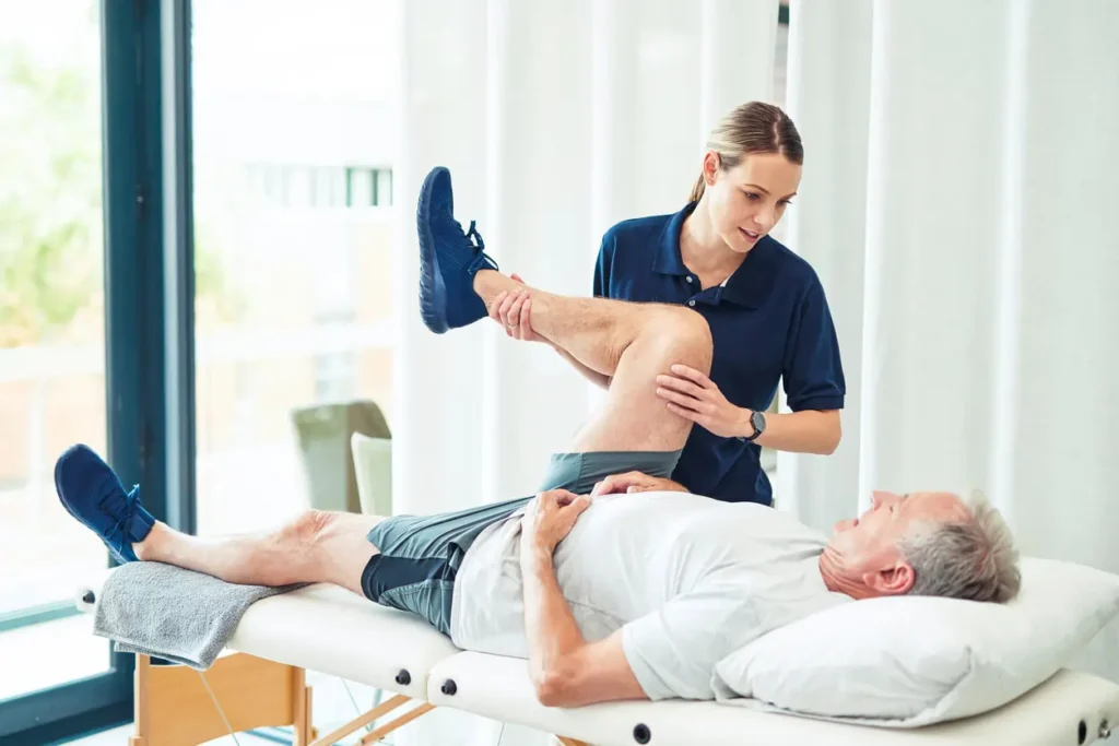 Revitalising Recovery: Effective Rehabilitation Strategies for Muscle Injuries 3 Physiotherapist assisting a patient with muscle recovery exercises Nazeing